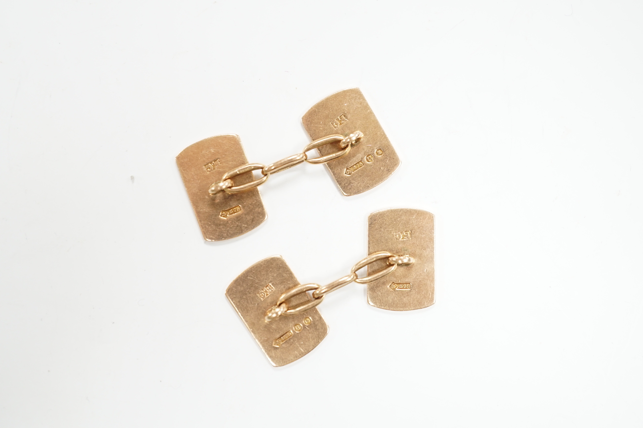 A pair of 1930's engine turned 9ct gold rounded rectangular cufflinks, 16mm, 8.8 grams.